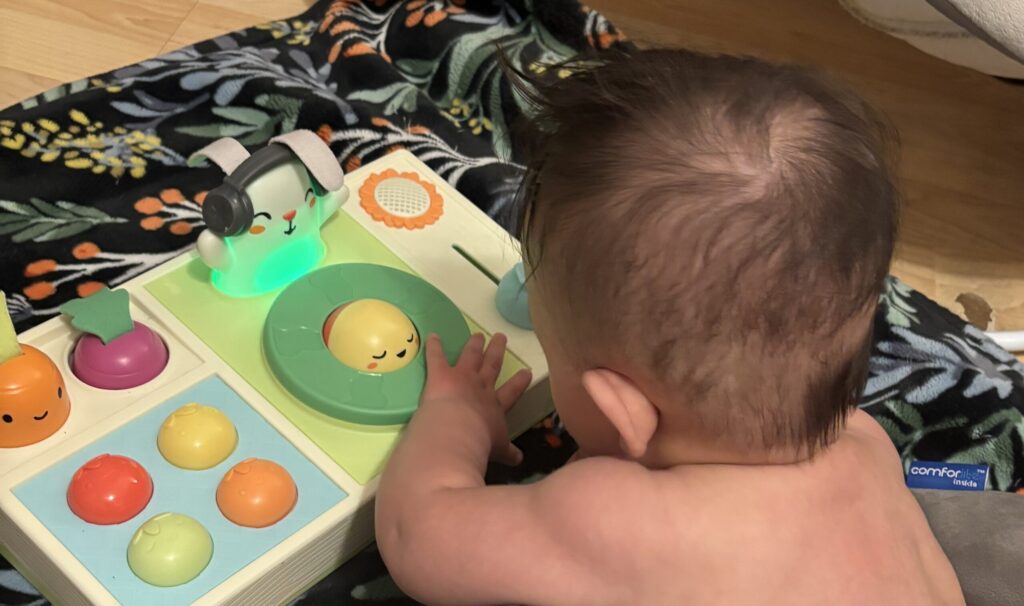 baby playing with toy